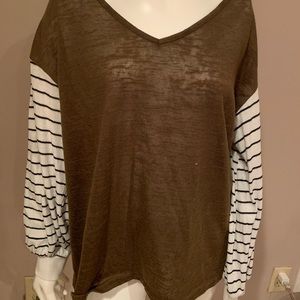 Olive top. With black & white stripes
